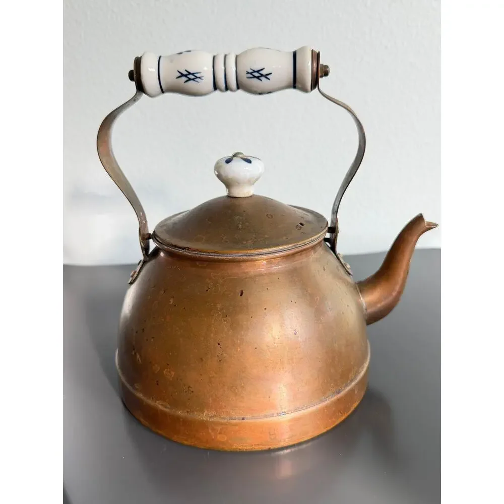 Vintage copper tea kettle with hand-painted blue and white porcelain handle lid